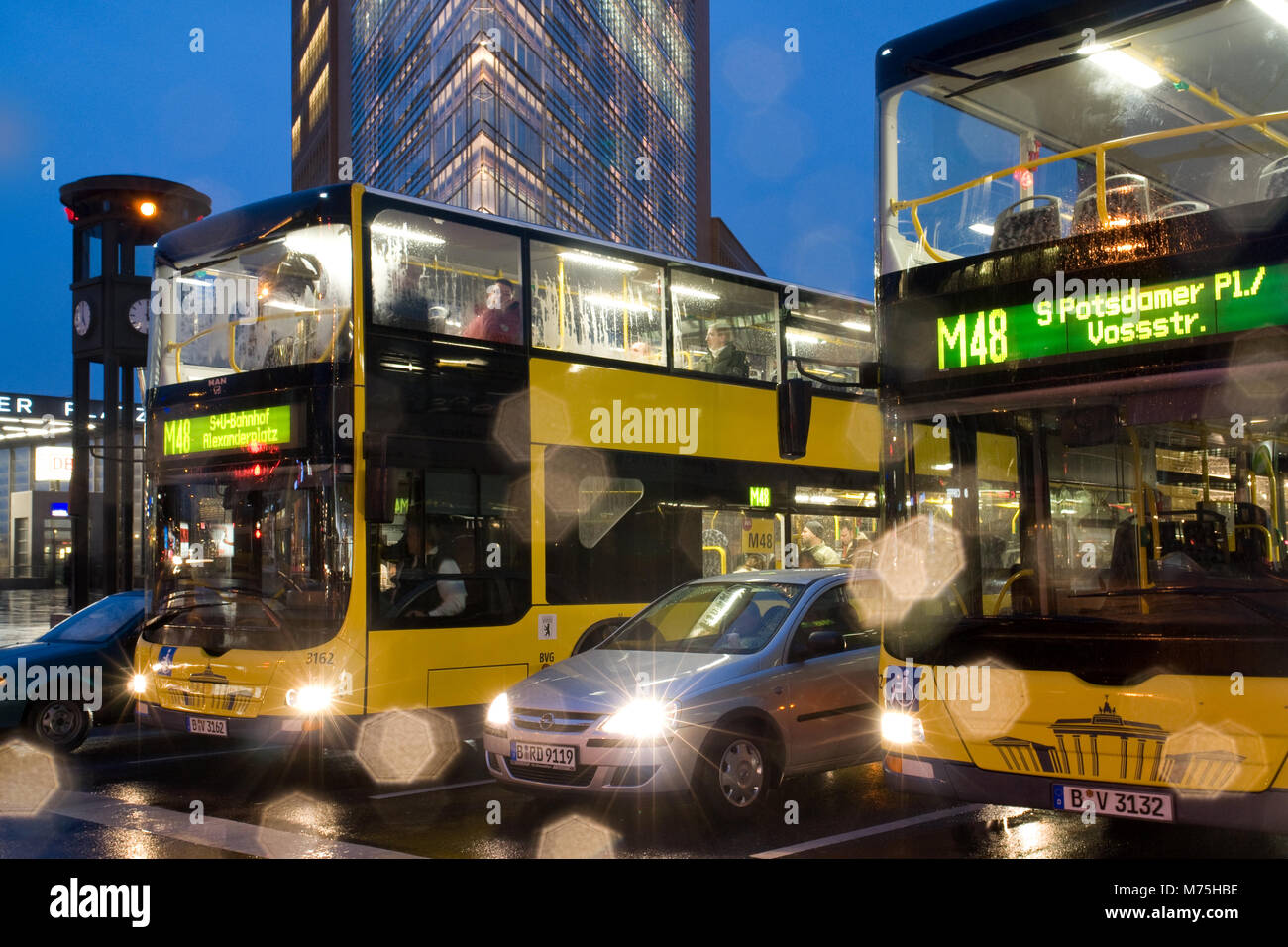 Berlin buses at Potsdamer Platz in the rain Stock Photo Alamy