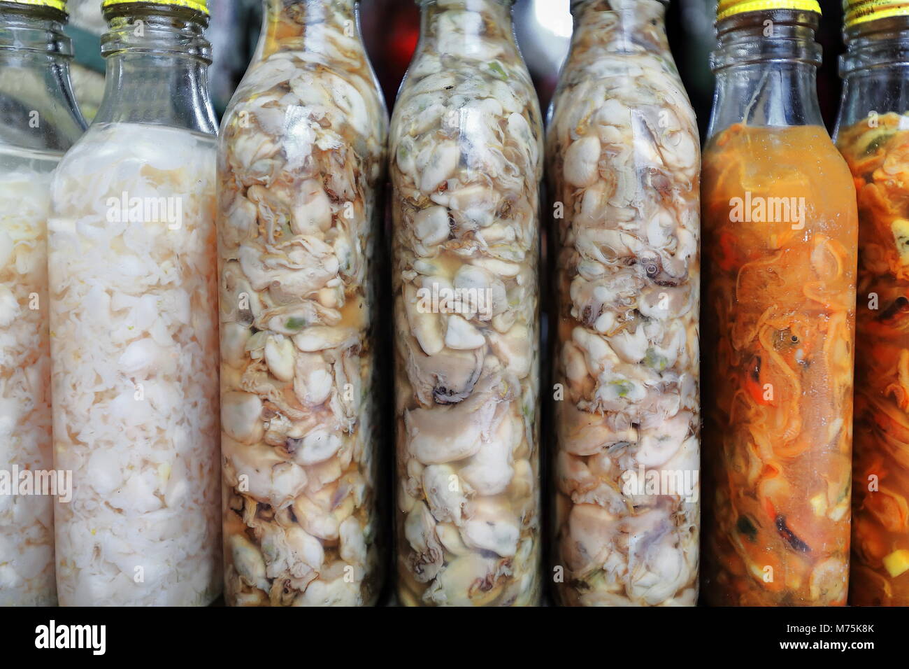 Filipino various pickled foods seafood and atchara or green papaya