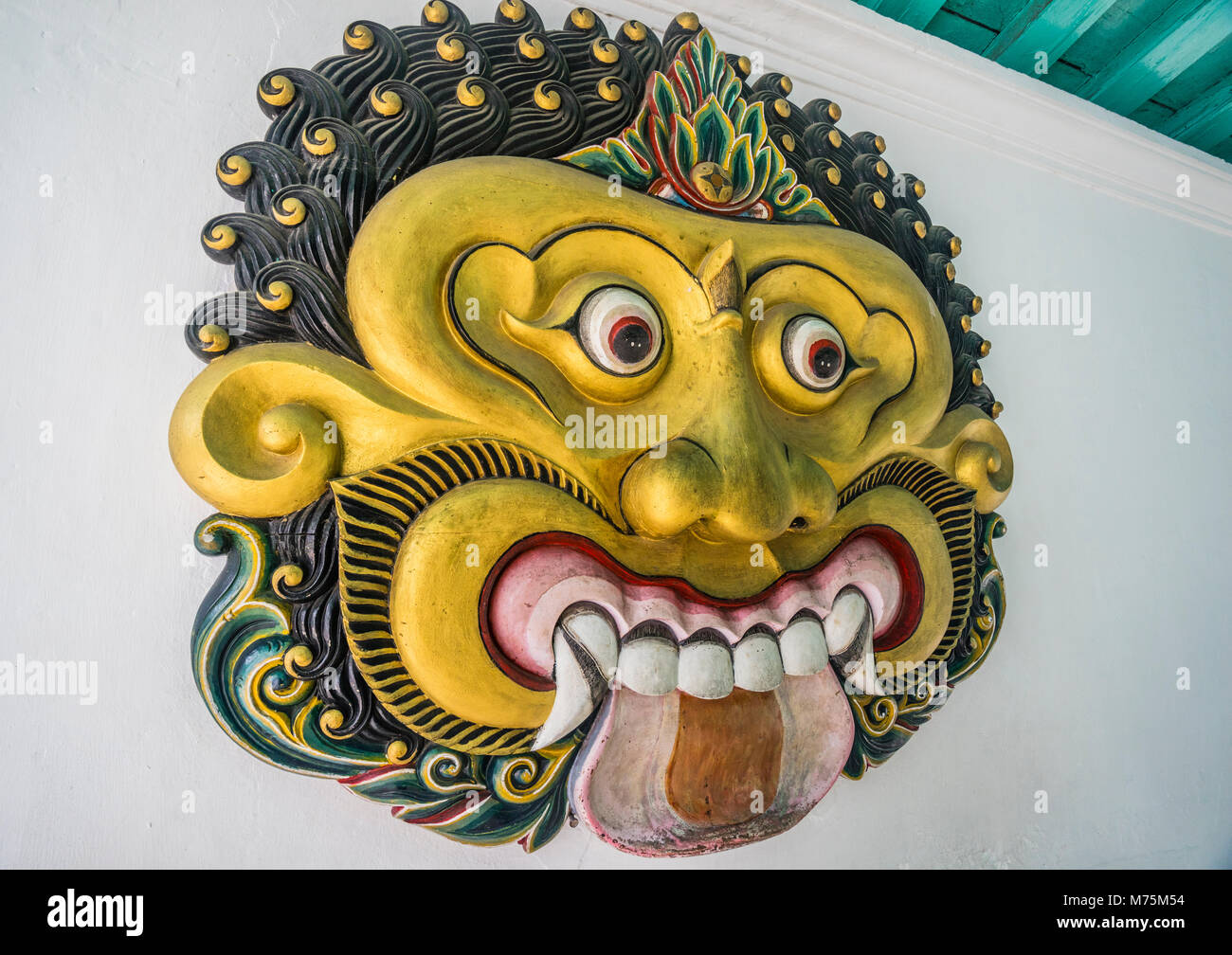 Batara Kala face, in Javanese mythology the the creator of light and earth and the god of destruction at the Kraton Ngayogyakarta Hadiningrat, the pal Stock Photo