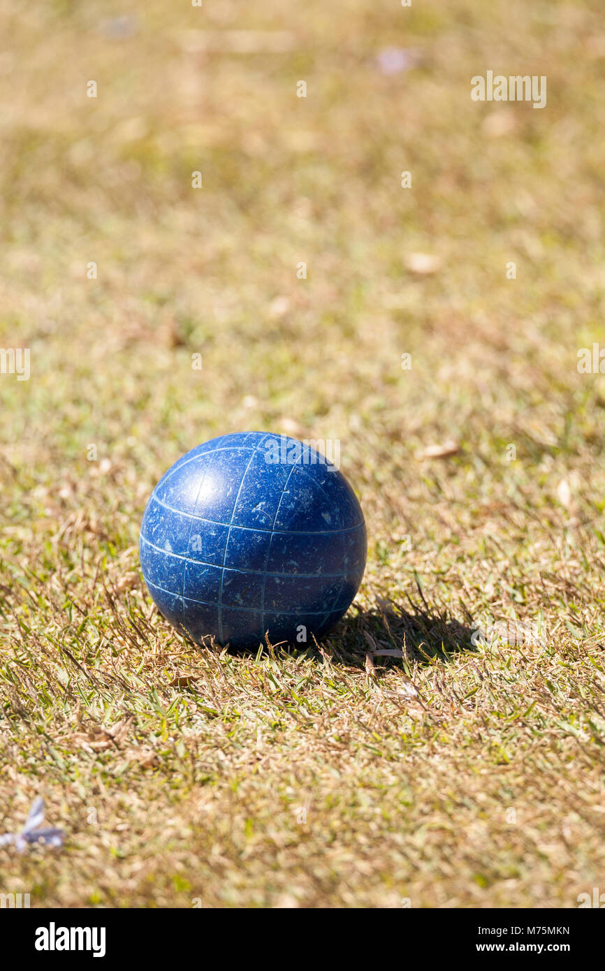 Bocce ball on the green grass of an open field ready for sport in