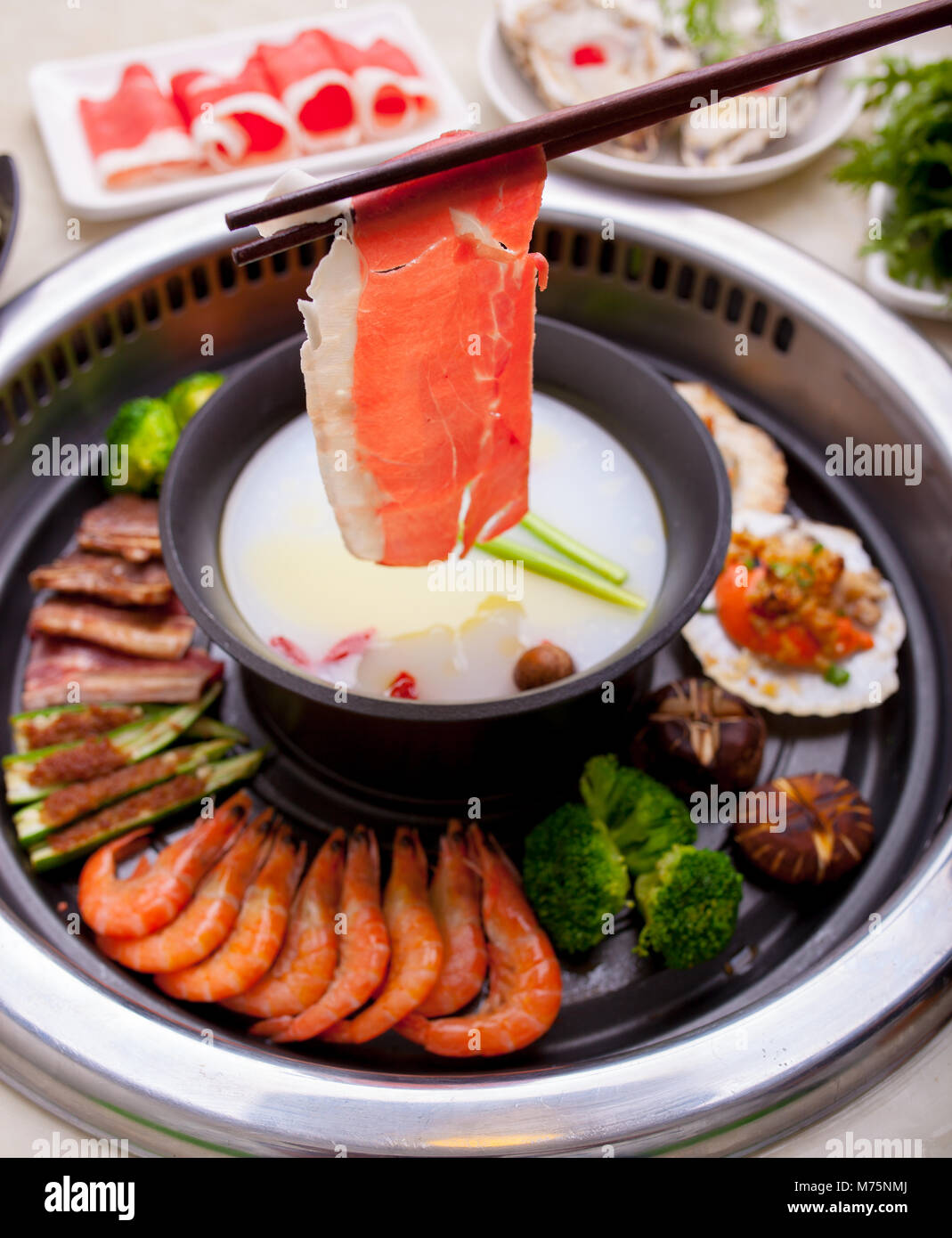 Barbecue and hot pot together Stock Photo Alamy