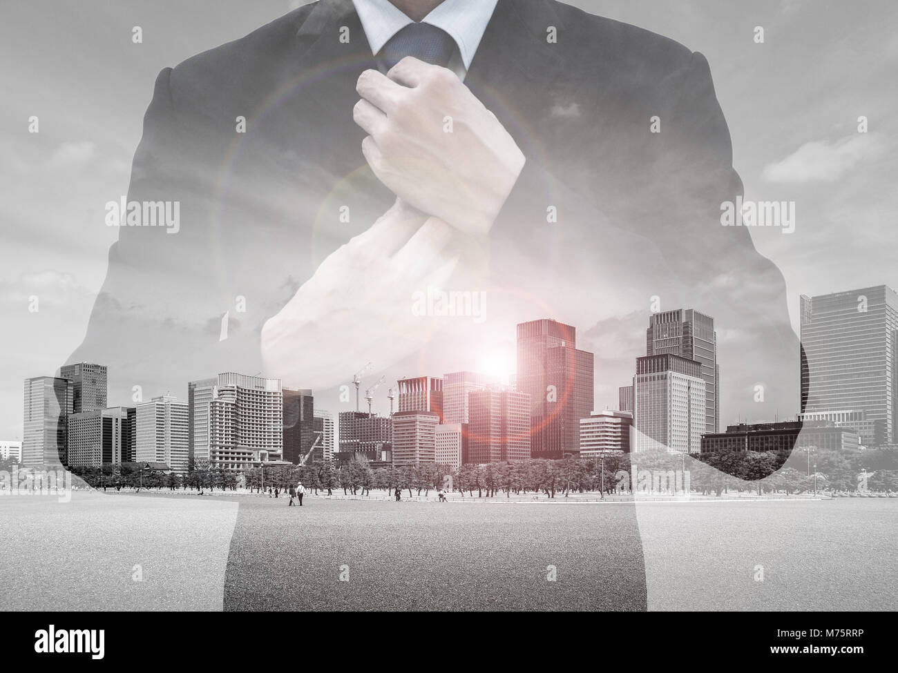 Double exposure of businessman in suit rearranging his tie and ...