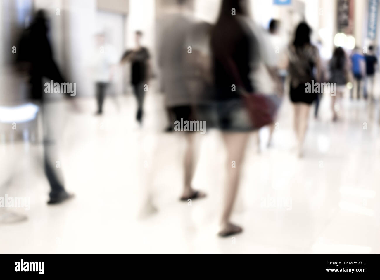Motion blur people walking in fashion mall Stock Photo - Alamy