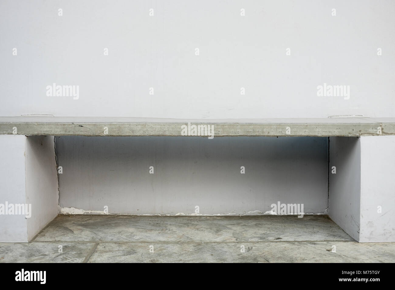 Outdoor concrete bench attached to the wall Stock Photo - Alamy