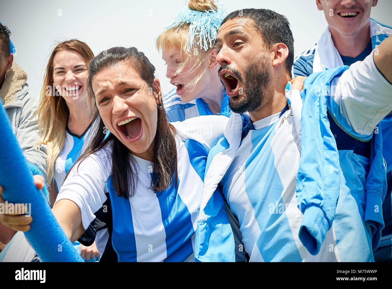 Argentinian football fans watching football match Stock Photo