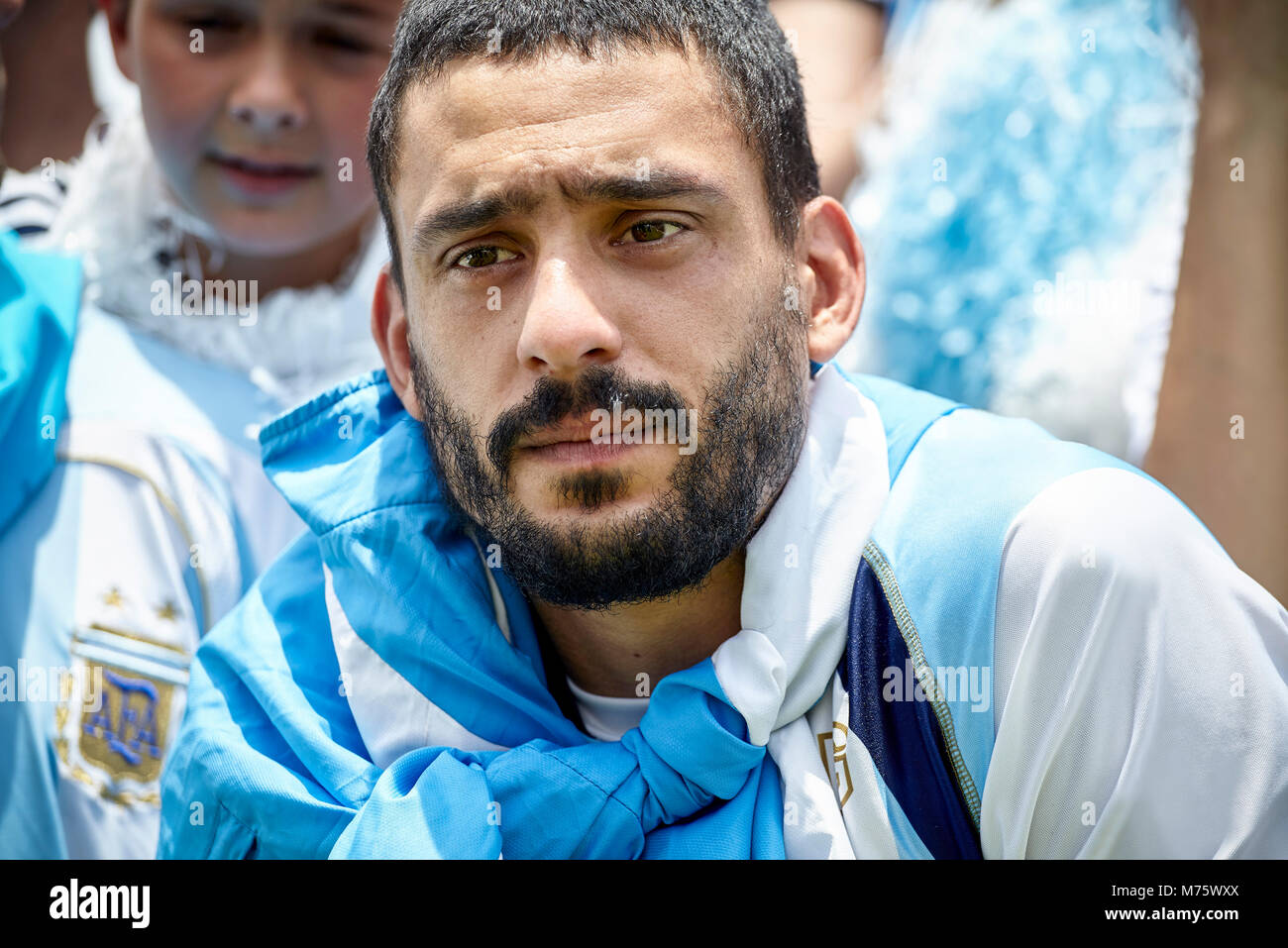 Argentinian football fan looking anxious at match Stock Photo