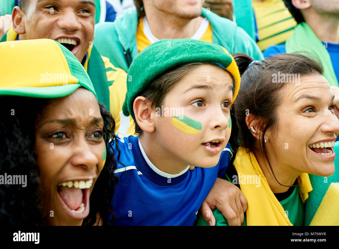 Brazilian football fans watching football match Stock Photo