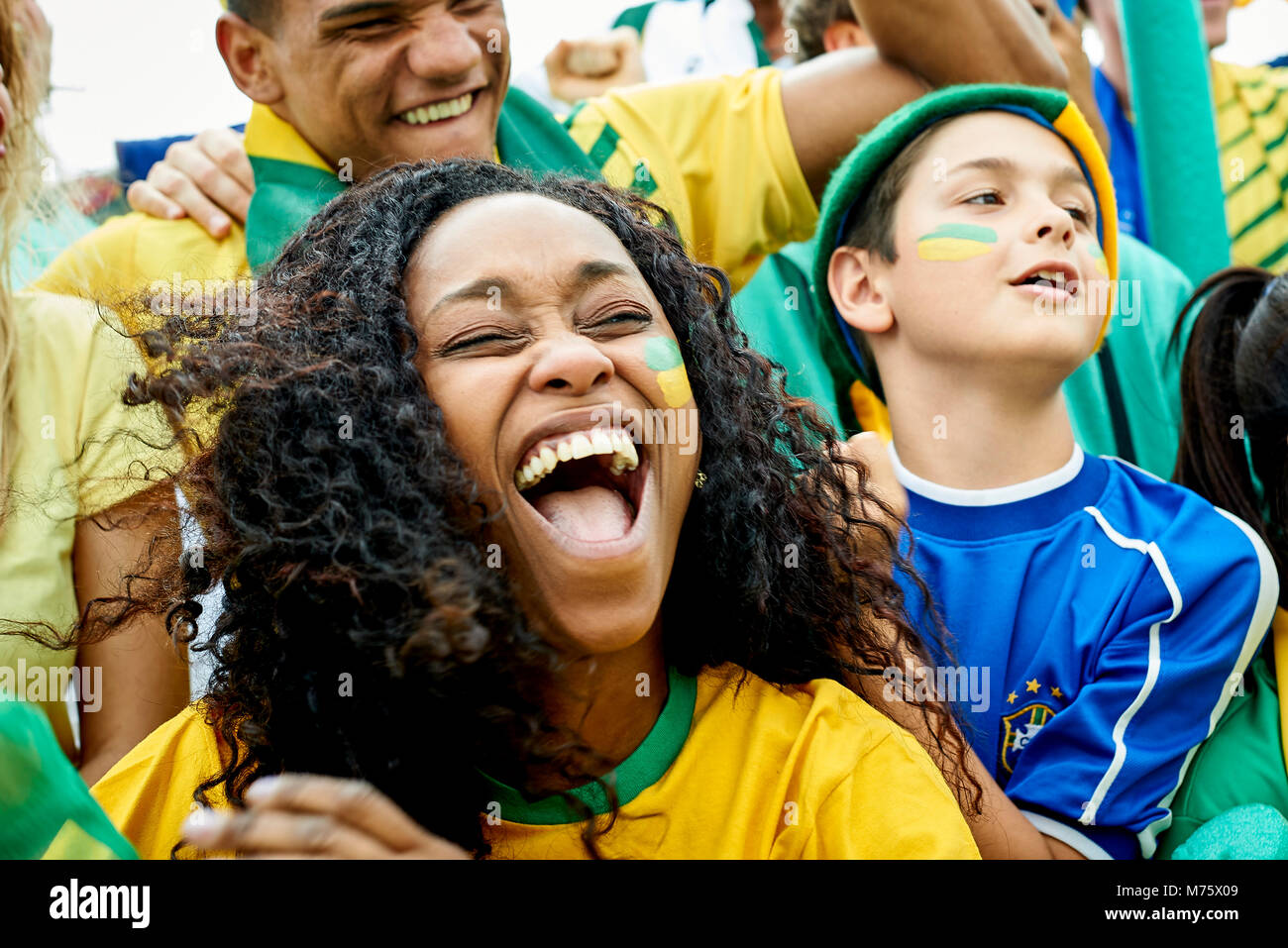 Brazilian football fans watching football match Stock Photo