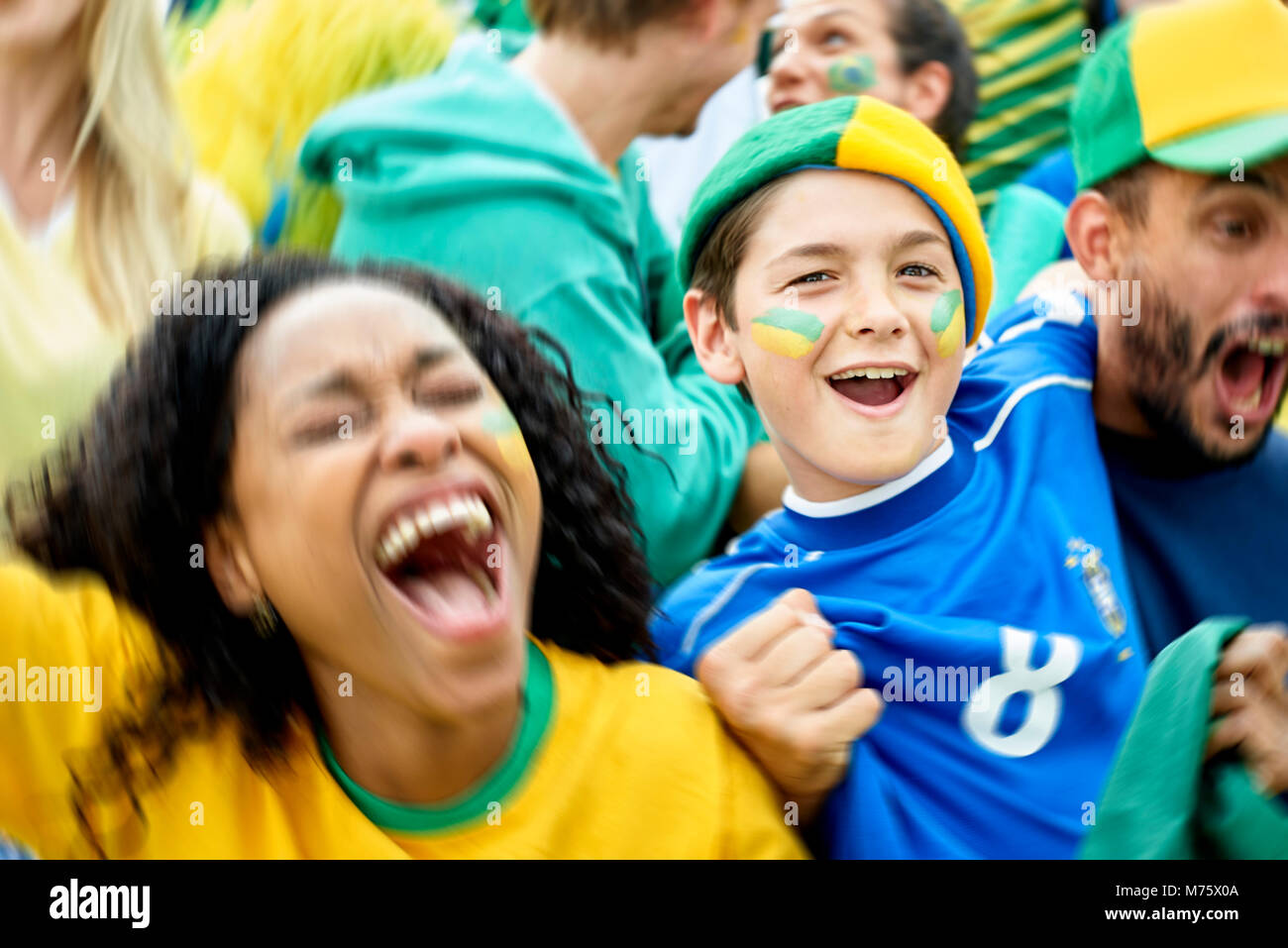 Brazilian football fans watching football match Stock Photo