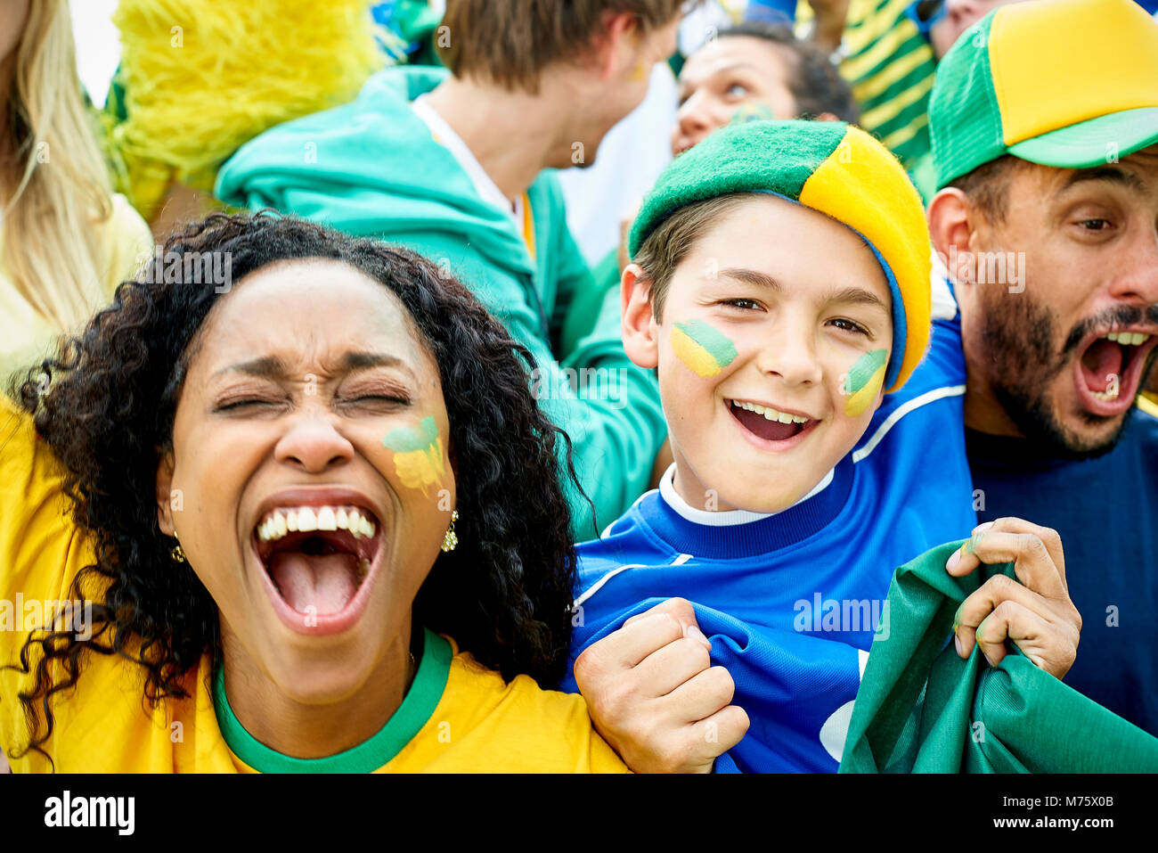 Brazilian football fans watching football match Stock Photo