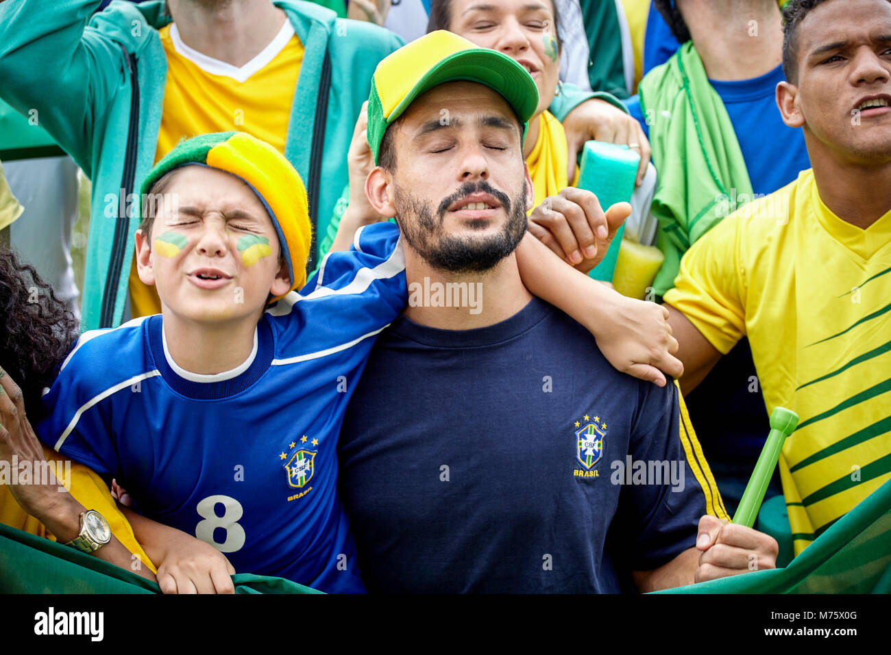 Brazilian football fans looking upset at football match Stock Photo