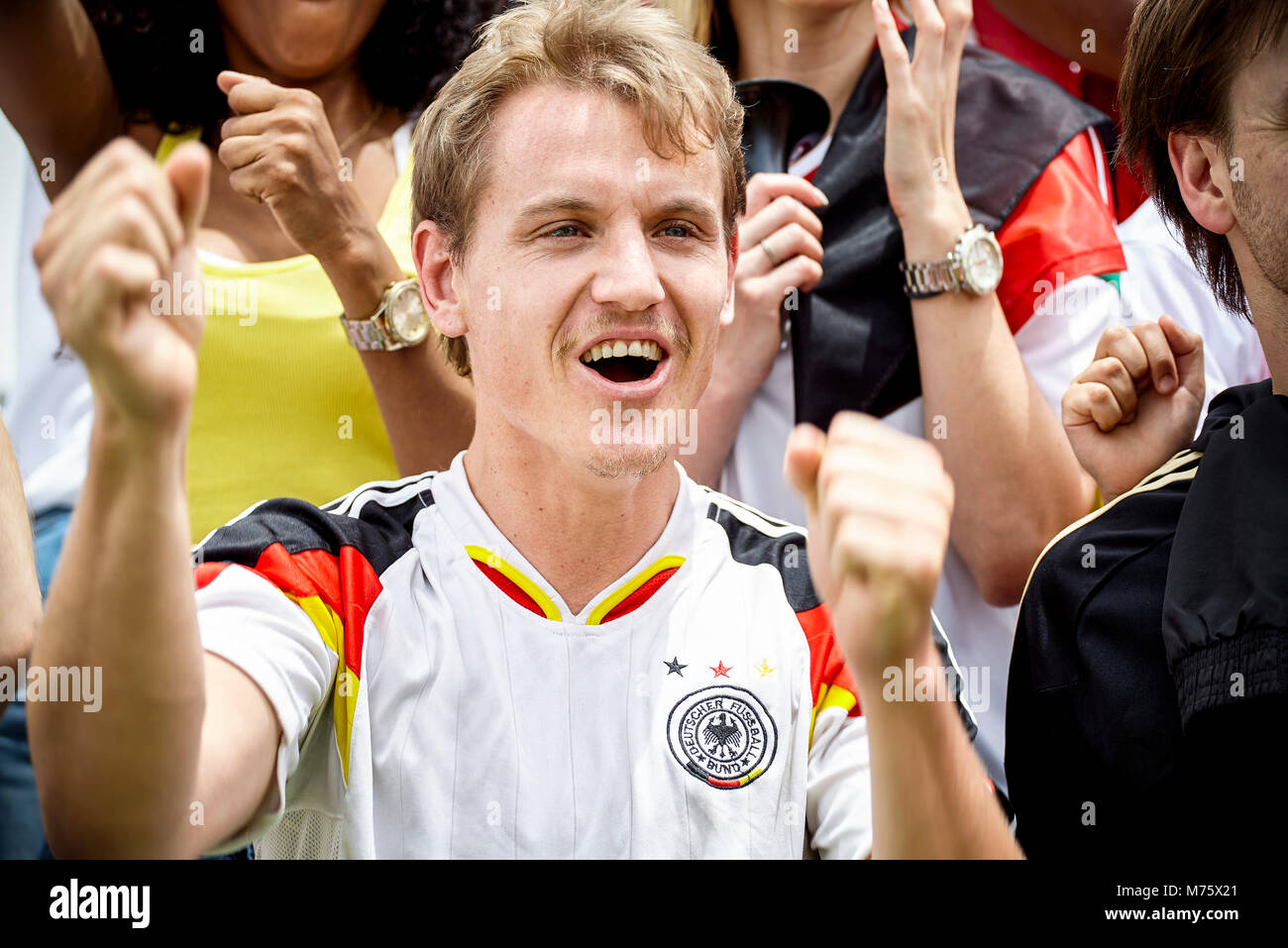 German football supporter cheering at match Stock Photo