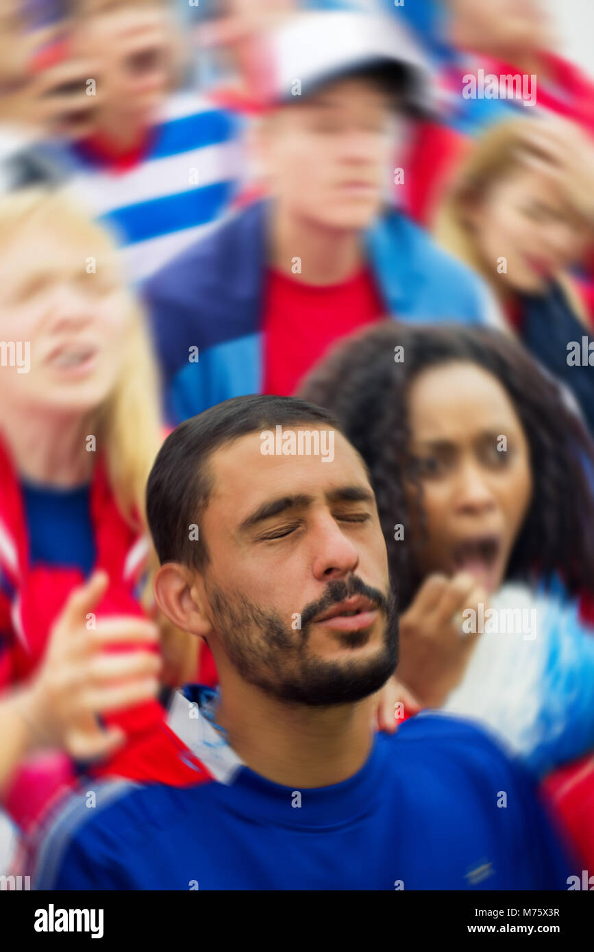 Sports enthusiasts looking upset during sports match Stock Photo