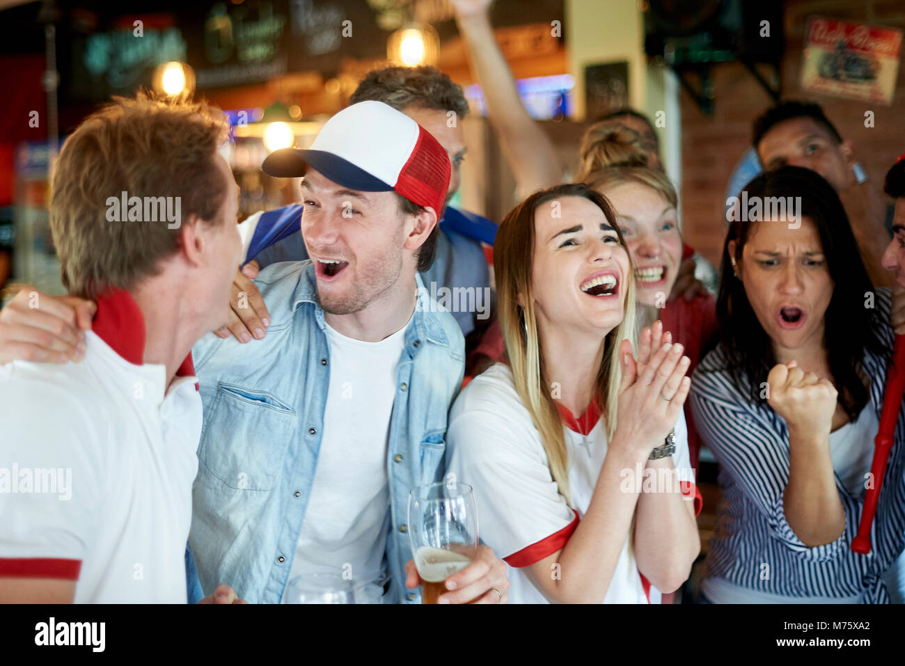 English soccer fans watching math together at pub Stock Photo