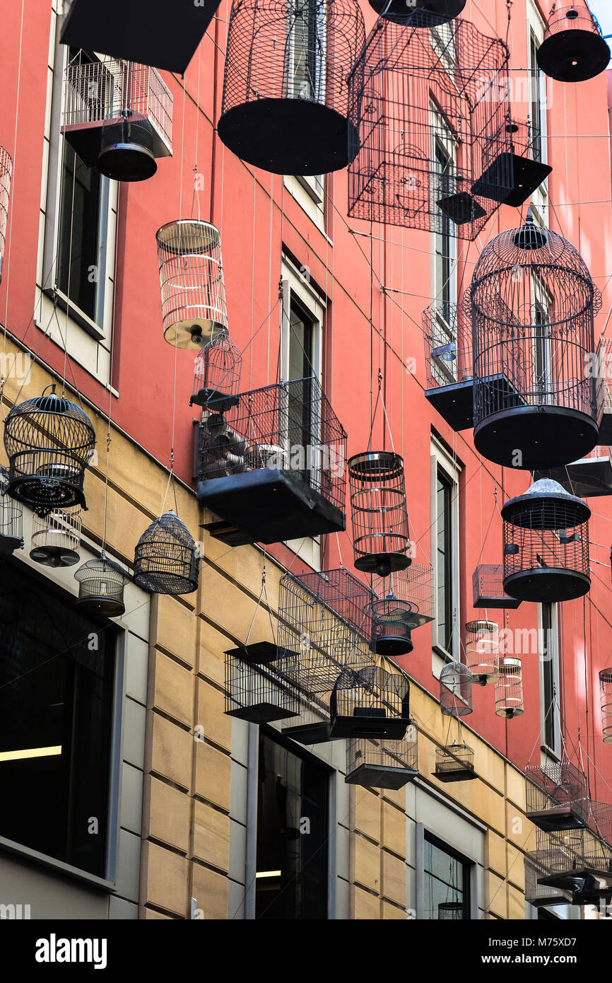An art installation of 50 hanging cages, titled Songs. It