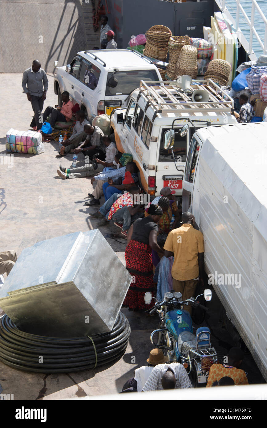 Tanzanian goods and people on a ferry in lake Victoria Stock Photo