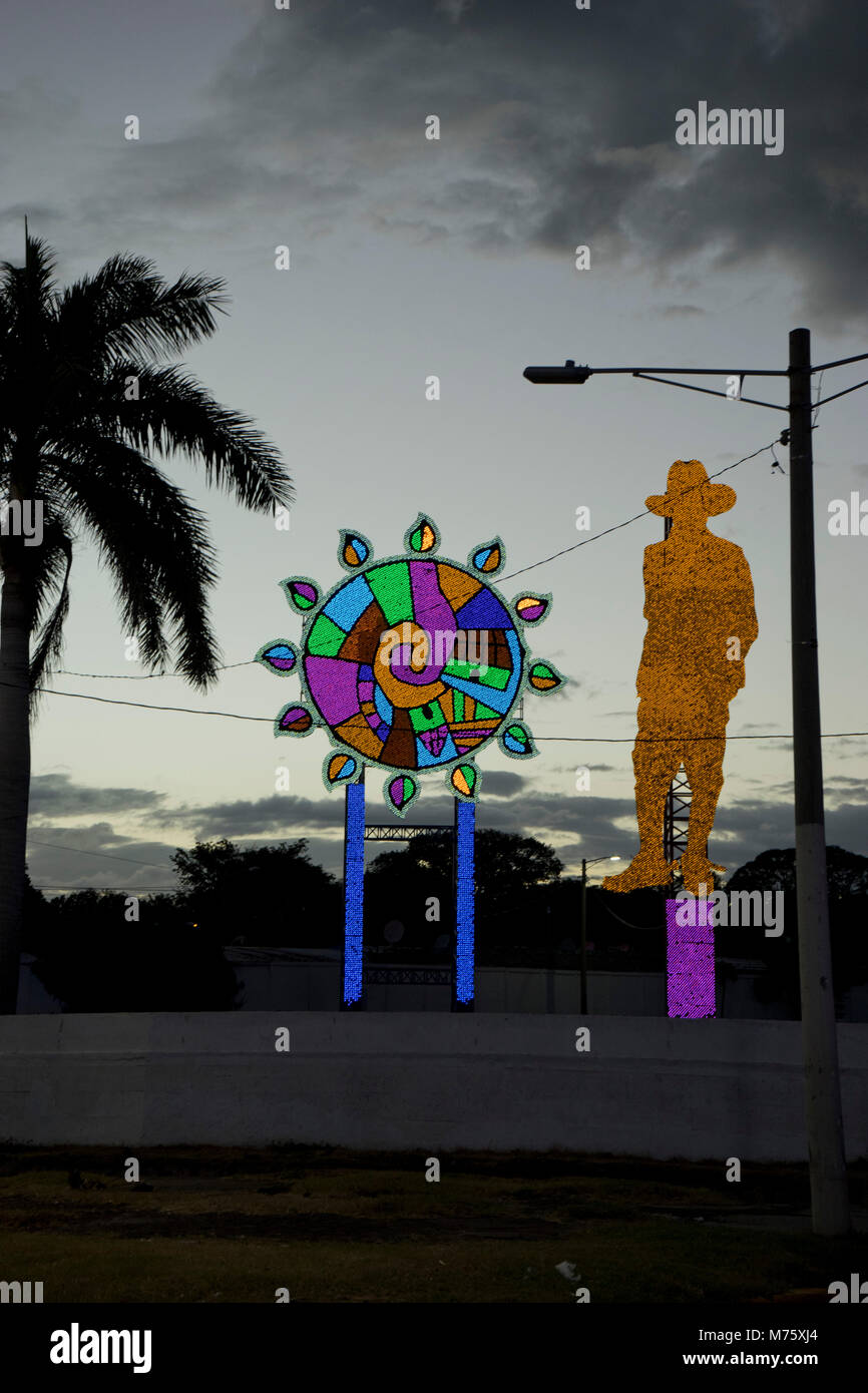 Statue to revolutionary hero Augusto Sandino, illuminated at night, in Managua, Nicaragua Stock Photo