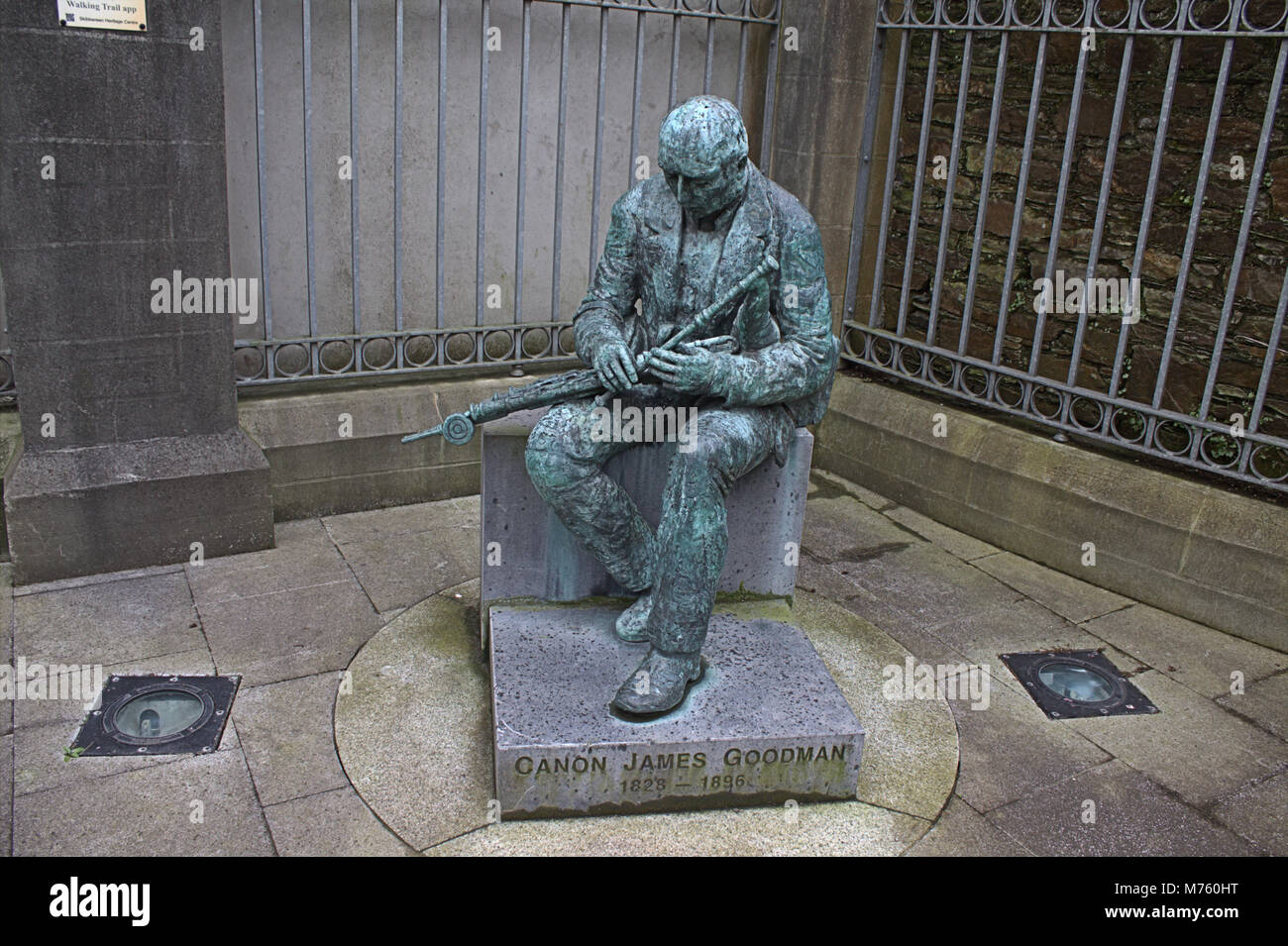 Bronze statue of Cannon Goodman, who was famous in West Cork and Ireland for collecting writing and playing old irish tunes and melodies. Stock Photo