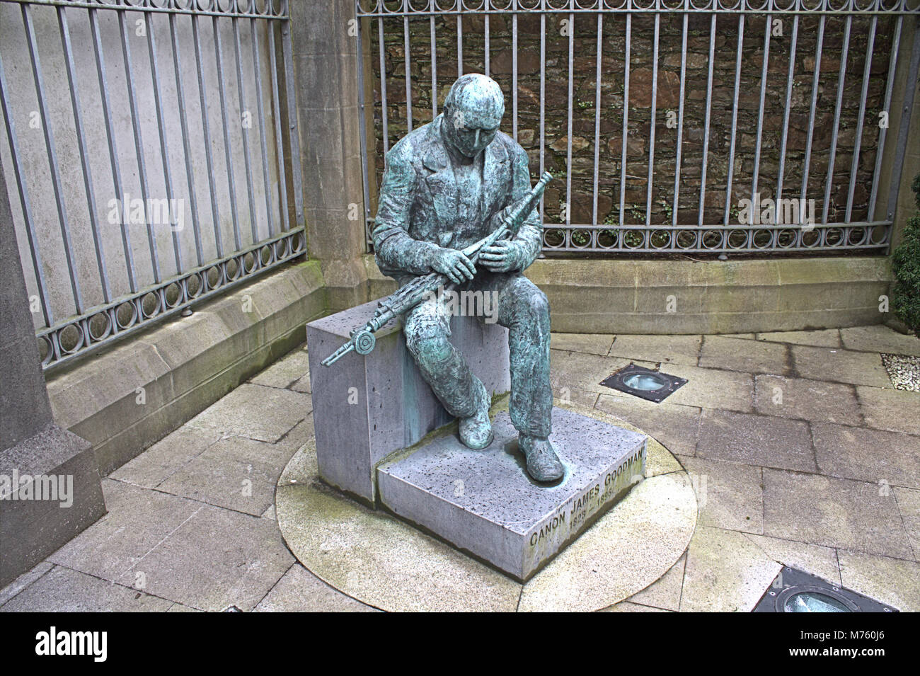 Bronze statue of Cannon Goodman, who was famous in West Cork and Ireland for collecting writing and playing old irish tunes and melodies. Stock Photo