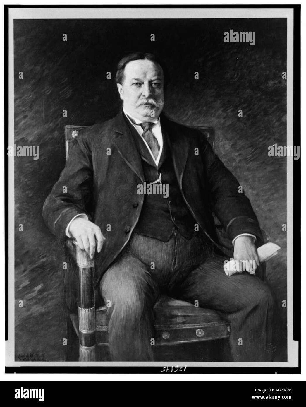 A formal portrait of President William H. Taft, showing him seated in a ...