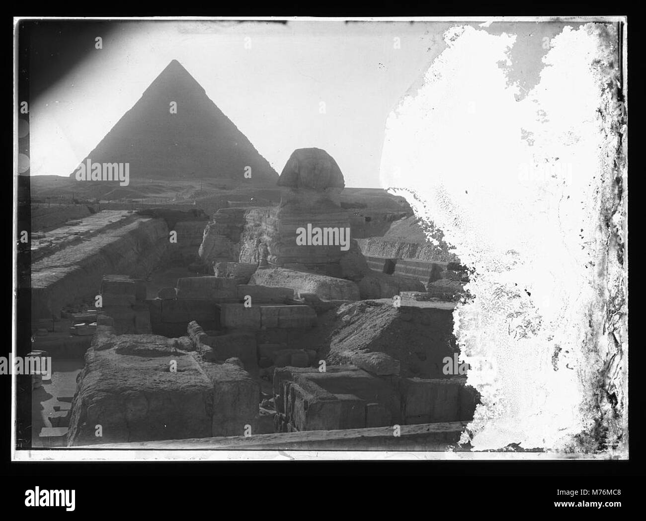 A historic view of the Great Pyramid of Giza and the Sphinx, two iconic ...