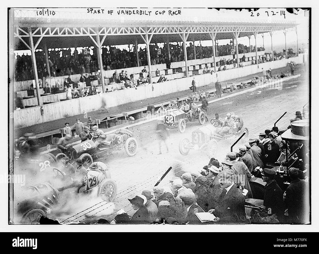 Early Start Racing This photograph captures the start of the Vanderbilt Cup Race, a ...