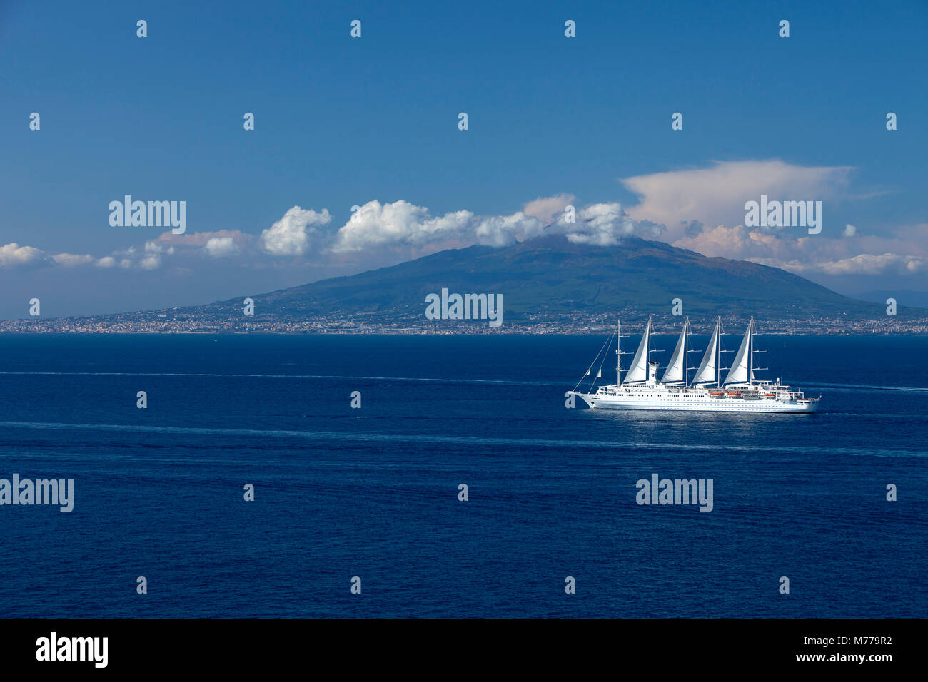 Mount Vesuvius from across the Bay of Naples with Wind Surf cruise ship in foreground, Campania, Italy, Europe Stock Photo