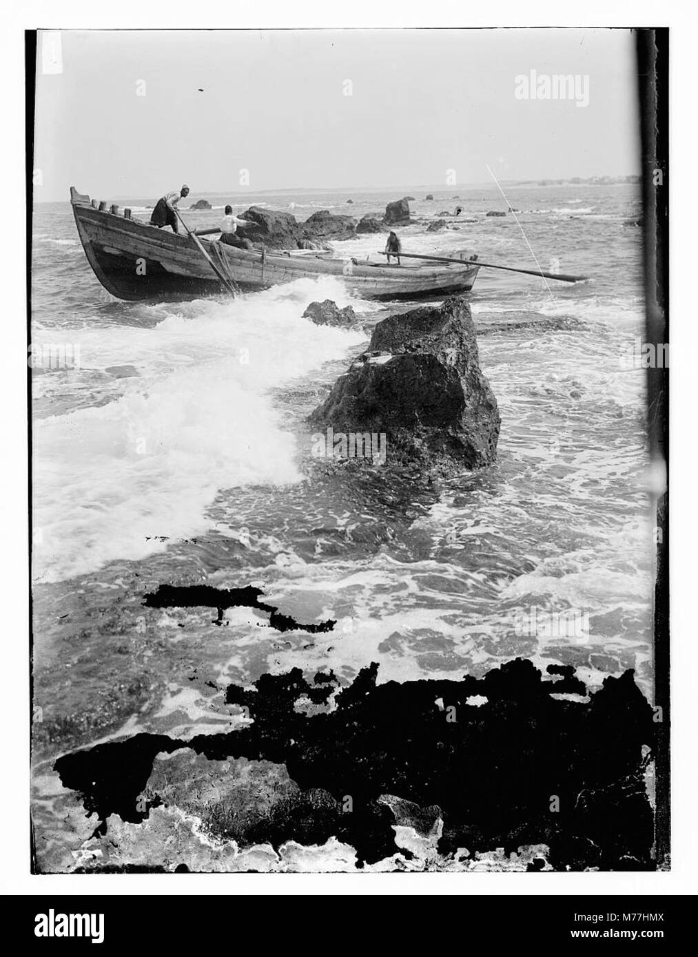 Boat going through the rocks at Jaffa LOC matpc.11617 Stock Photo - Alamy