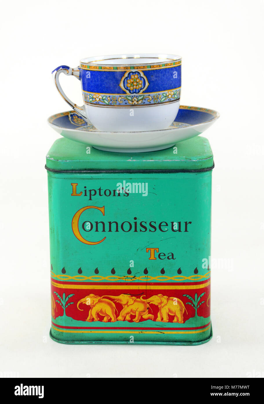 A vintage tin of Lipton's connoisseur tea with teacups and saucers. Stock Photo