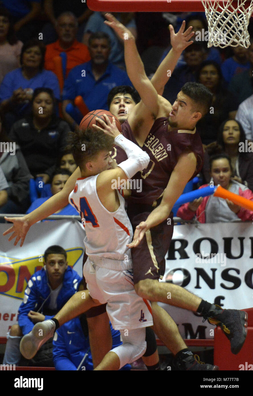 U.S. 8th Mar, 2018. SPORTS -- Belens' Alexis Aguilar, center, and Matthew Padilla, right, blocks Los Lunas' Joe Dominguez, 14, during the 5A State semifinal boys basketball game in the Pit on Thursday, March 8, 2018. Credit: Greg Sorber/Albuquerque Journal/ZUMA Wire/Alamy Live News Stock Photo