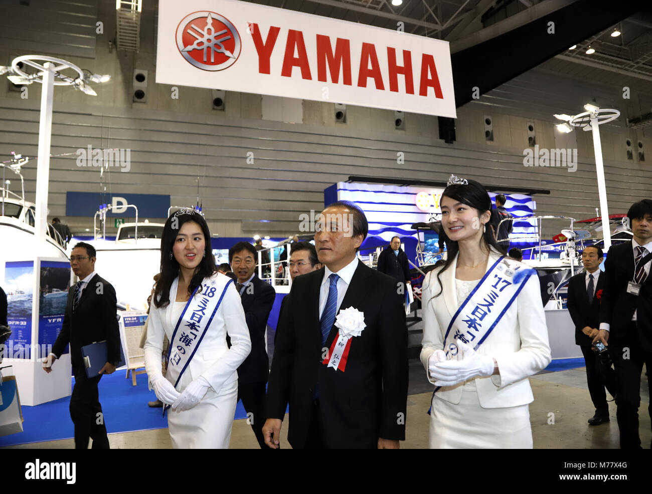 Yokohama, Japan. 8th Mar, 2018. Hiroyuki Yanagi (C), Japan's Yahama Motor chairman and Japan Marine Industry Association chairman, accompanied by Miss Nippon Marine Day 2017 Yu Mikami (R) and Miss Nippon Marine Day 2018 Remi Yamada (L) inspects the Japan International Boat Show after the opening ceremony in Yokohama, suburban Tokyo on Thursday, March 8, 2018. Toyota will strat to sell similar and bigger sized vessel in the United States in 2019 and will put it on the domestic market in 2020. Credit: Yoshio Tsunoda/AFLO/Alamy Live News Stock Photo