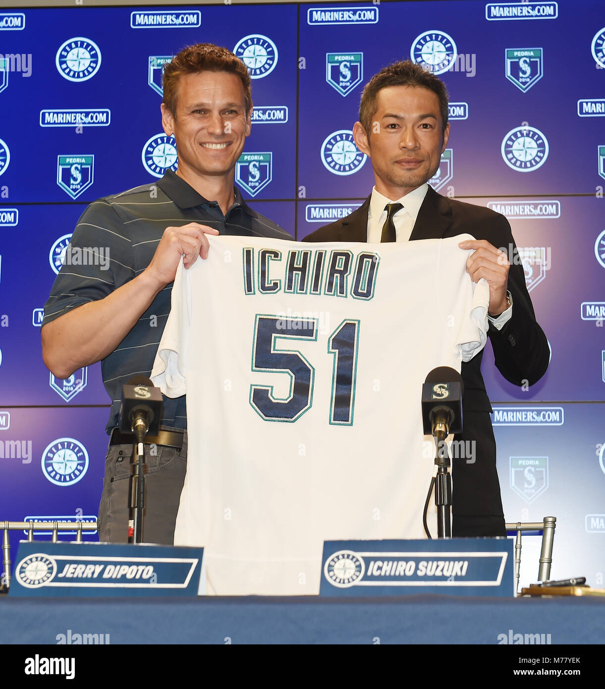 Ichiro Suzuki (R), Major League Baseball team Seattle Mariners new signing  outfielder holds up his jersey with Mariners GM Jerry Dipoto at a press  conference at the team's spring training baseball complex
