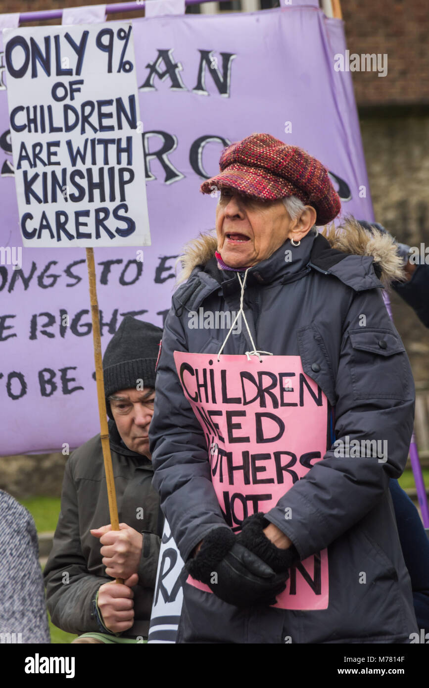 London, UK. 8th March 2018. Selma James, whose article on the Global Women's Strike was published today in The Guardian at their mock trial of the Family Courts in an International Women’s Day protest in front of Parliament. Speakers included mothers who have had children unjustly removed and others who read out shocking comments made in court by judges. The UK has the highest rate of adoptions in Europe, almost all without consent of their birth family. In some working class areas, 50% of children are referred to social services and that families of colour, immigrant and disabled are all disp Stock Photo