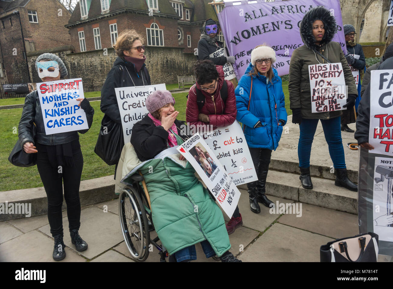 London, UK. 8th March 2018. Global Women's Strike mock trial of the Family Courts in an International Women’s Day protest in front of Parliament. Speakers included mothers who have had children unjustly removed and others who read out shocking comments made in court by judges. The UK has the highest rate of adoptions in Europe, almost all without consent of their birth family. ey say that poverty, often a result of bebefit cuts Credit: Peter Marshall/Alamy Live News Stock Photo