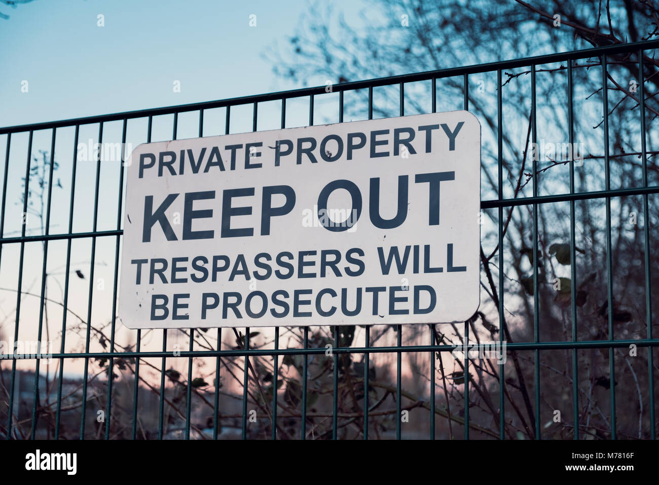 Keep Out sign on the perimeter fence of Dulwich Hamlet Football Club on the 8th March. These signs were put up by property developer Meadows, who own the grounds after their planning application was rejected by Southwark Council. Relations with the DHFC and Meadows  have deteriorated rapidly. Meadows have sent a £121,000 bill for back rent, and trademarked DHFC and Dulwich Hamlet Football Club. They have sent a cease and desist notice and locked DHFC out of the grounds. Stock Photo