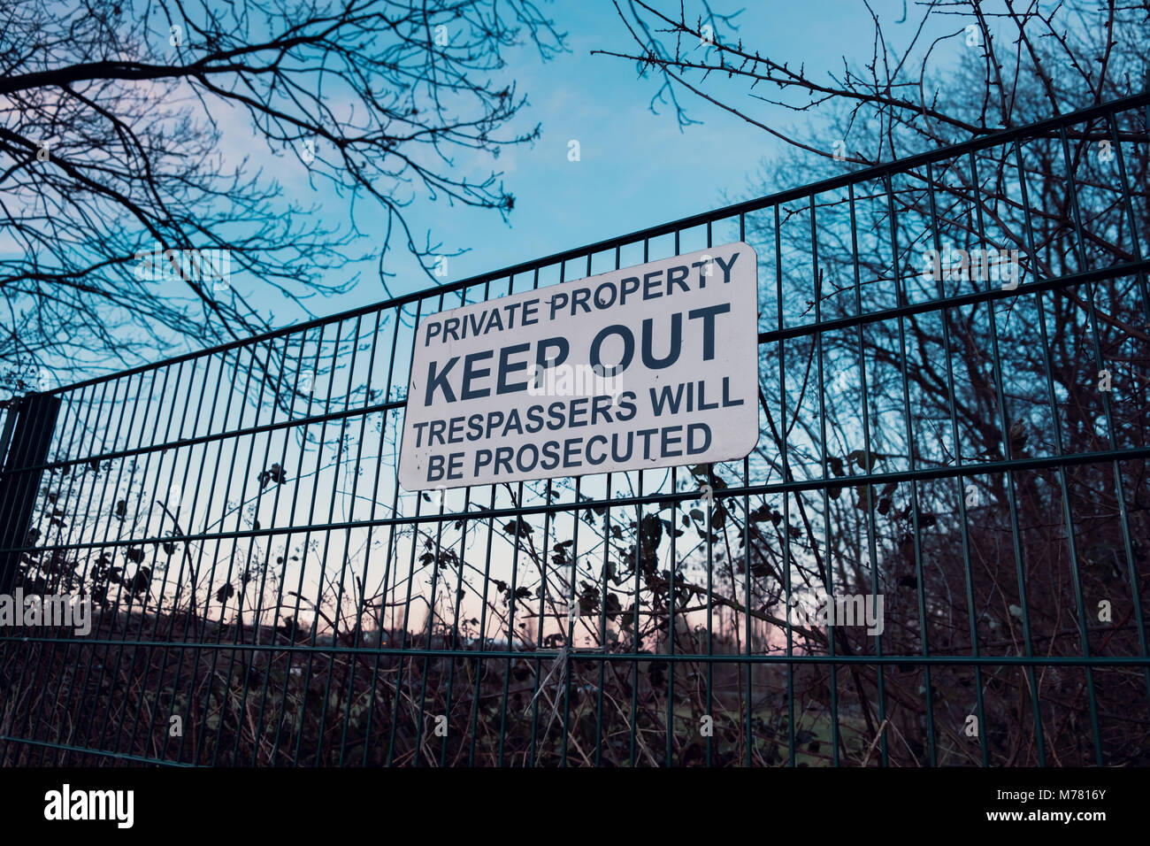 Keep Out sign on the perimeter fence of Dulwich Hamlet Football Club on the 8th March. These signs were put up by property developer Meadows, who own the grounds after their planning application was rejected by Southwark Council. Relations with the DHFC and Meadows  have deteriorated rapidly. Meadows have sent a £121,000 bill for back rent, and trademarked DHFC and Dulwich Hamlet Football Club. They have sent a cease and desist notice and locked DHFC out of the grounds. Stock Photo