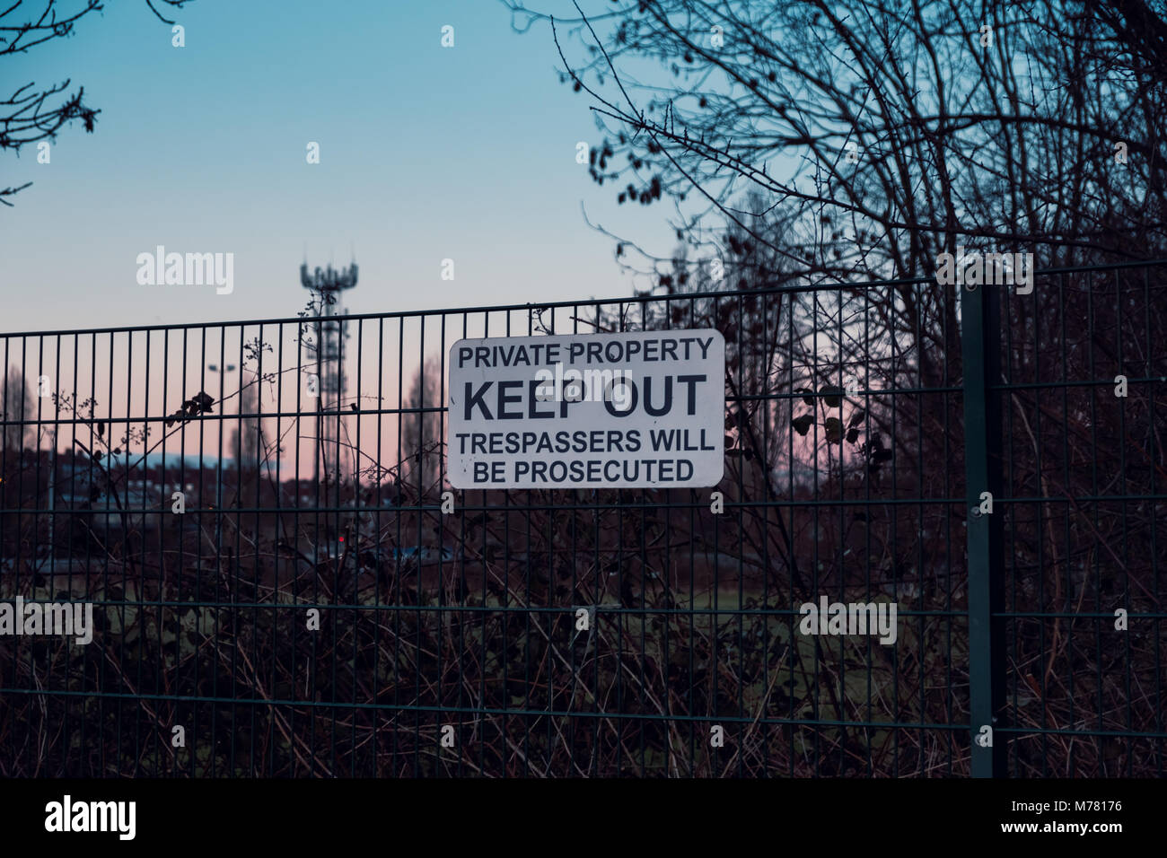 Keep Out sign on the perimeter fence of Dulwich Hamlet Football Club on the 8th March. These signs were put up by property developer Meadows, who own the grounds after their planning application was rejected by Southwark Council. Relations with the DHFC and Meadows  have deteriorated rapidly. Meadows have sent a £121,000 bill for back rent, and trademarked DHFC and Dulwich Hamlet Football Club. They have sent a cease and desist notice and locked DHFC out of the grounds. Stock Photo