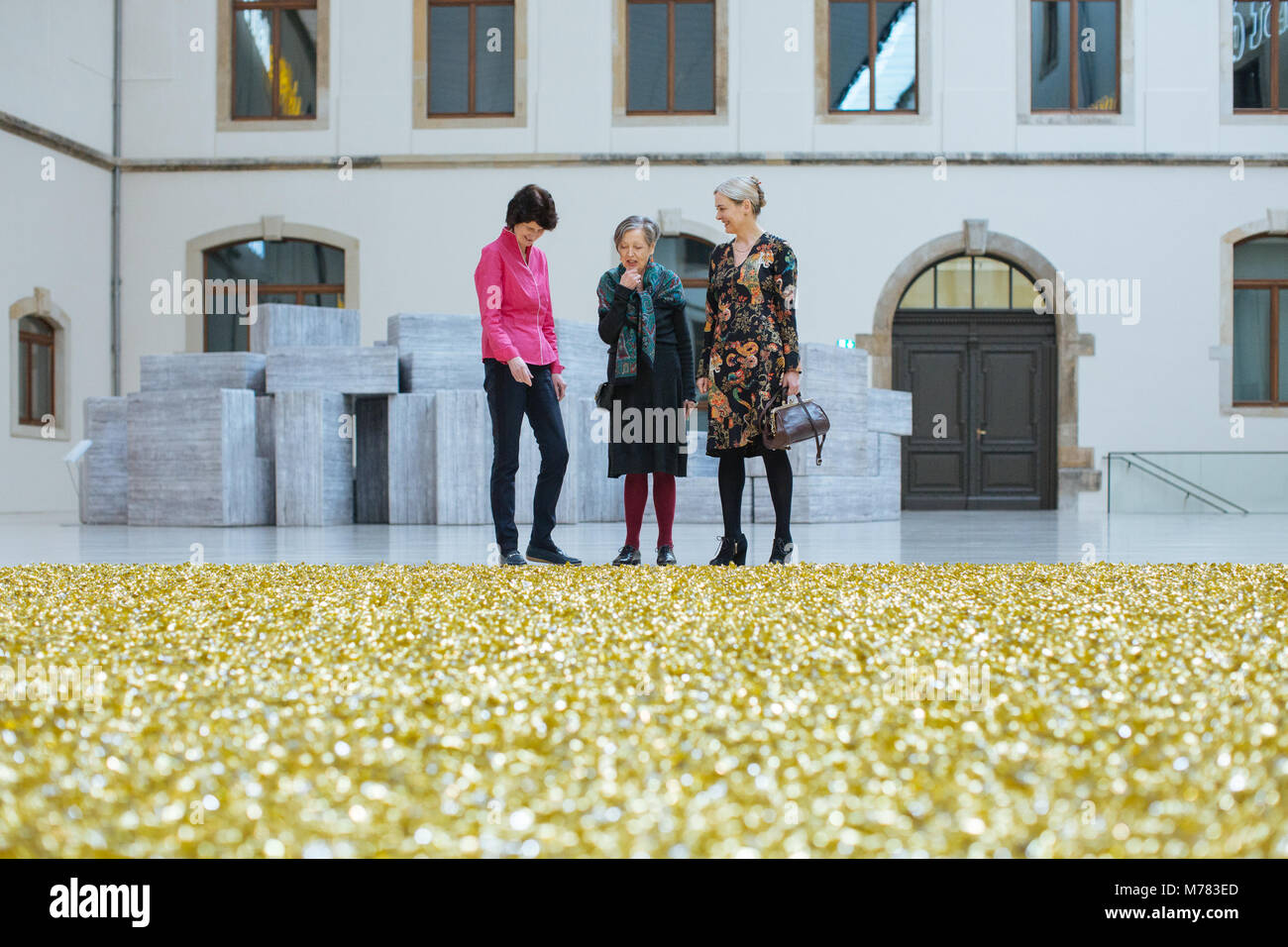Dresden, Germany. 09 March 2018, Saxony's Science and Arts Minister Eva-Maria Stange of the Social Democratic Party (SPD, l-r), art patron Erika Hoffmann and general director of the Dresden's art collection stand around Felix Gonzalez-Torres' piece 'Candy spills' at the Albertium. A total of 1200 artworks were collected by the Hoffmann family since 1910. Now, Hoffmann is handing over the private collection to the city of Dresden. Photo: Oliver Killig/dpa-Zentralbild/dpa Credit: dpa picture alliance/Alamy Live News Stock Photo