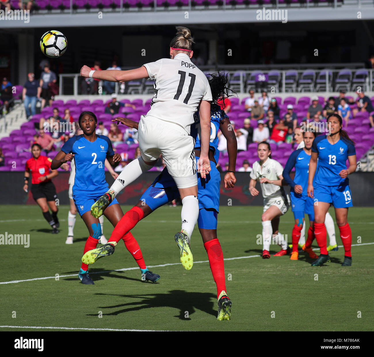Orlando, Florida, USA. 7th Mar, 2018. Germany forward Alexandra Popp (11) wins a header over France defender Griedge Mbock Bathy (19) during the first half of the SheBelieves Cup women's soccer match between the German Women's National Team and the French Women's National Team at the Orlando City Stadium in Orlando, Florida. Credit: Mario Houben/ZUMA Wire/Alamy Live News Stock Photo