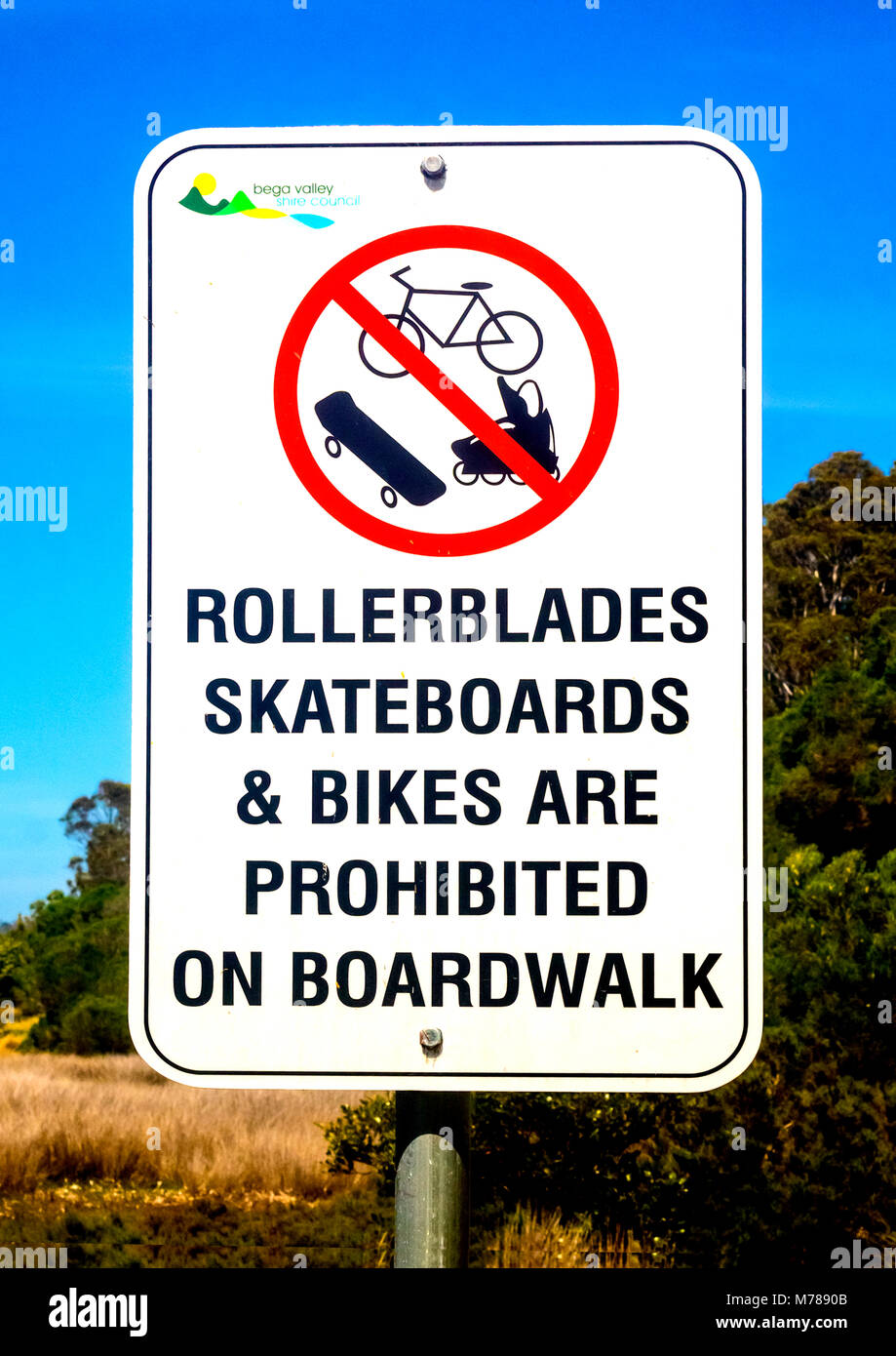 Sign prohibits bikes and other forms of transport on boardwalk Stock Photo