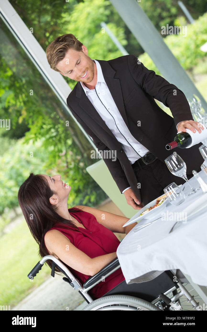man pouring wine to the ladys glass Stock Photo