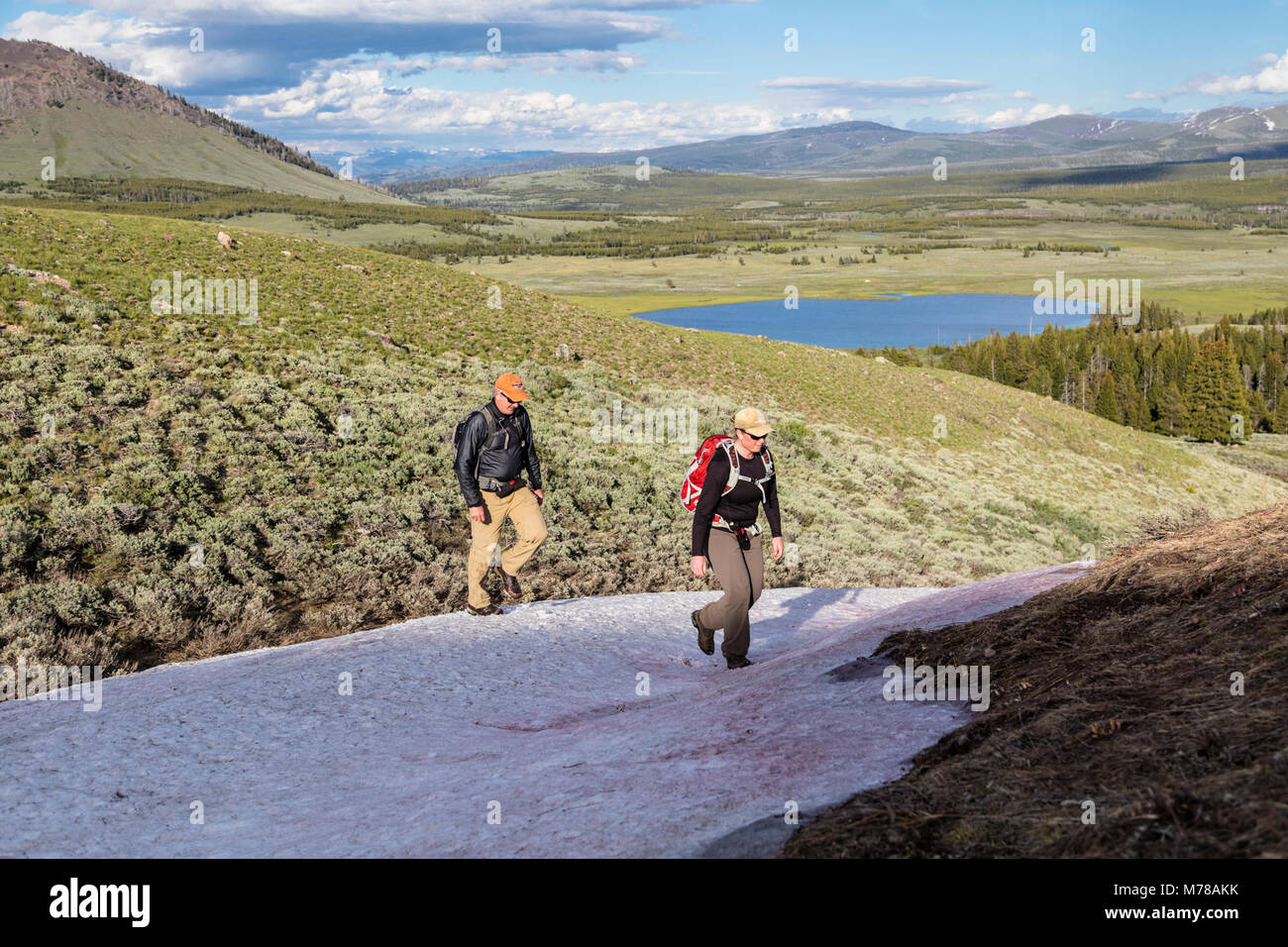 Hikers behind Swan Lake Stock Photo Alamy