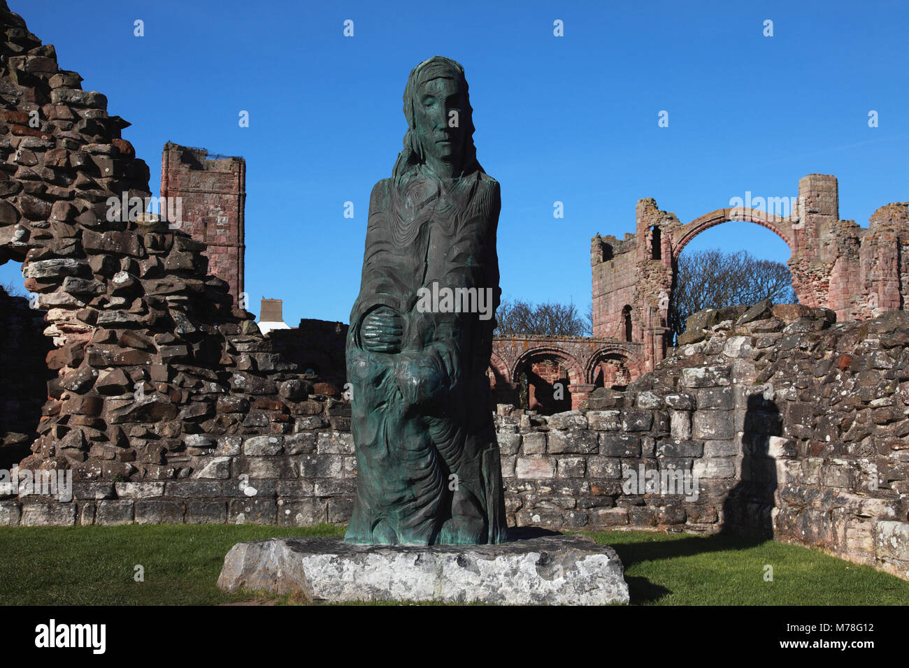 The statue of Saint Cuthbert by Fenwick Lawson placed at Lindisfarne