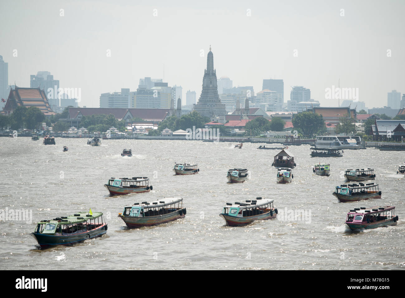 Boat trafic at the chao phraya river in the city of Bangkok in Thailand ...