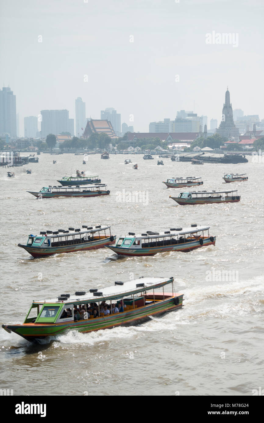 Boat trafic at the chao phraya river in the city of Bangkok in Thailand ...