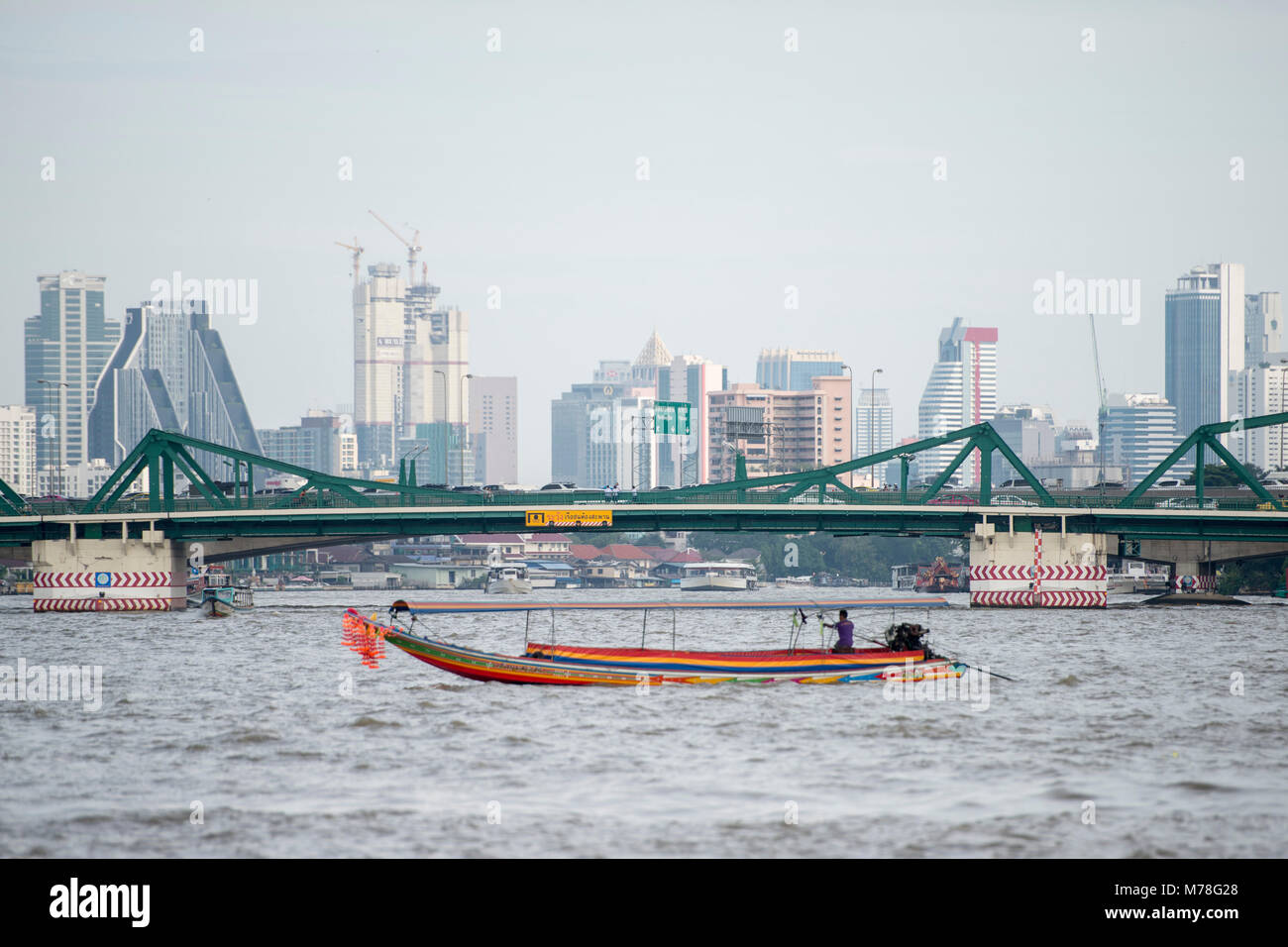 Boat trafic at the chao phraya river in the city of Bangkok in Thailand ...