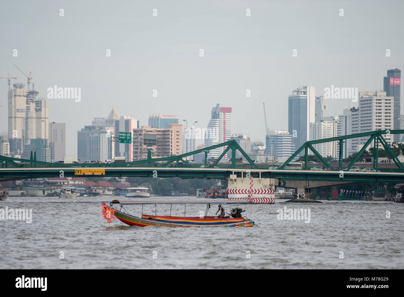 Boat trafic at the chao phraya river in the city of Bangkok in Thailand ...
