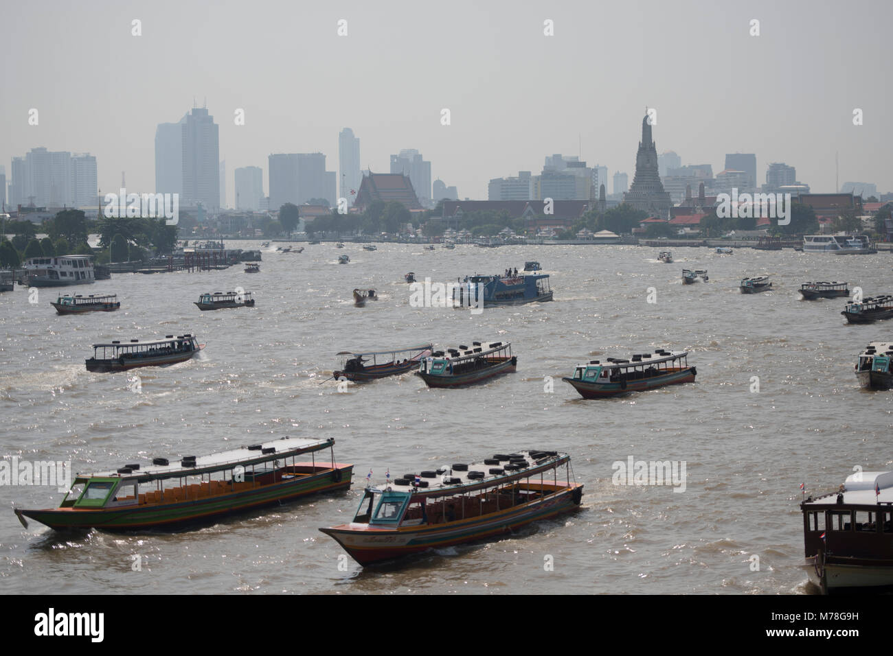 Boat trafic at the chao phraya river in the city of Bangkok in Thailand ...
