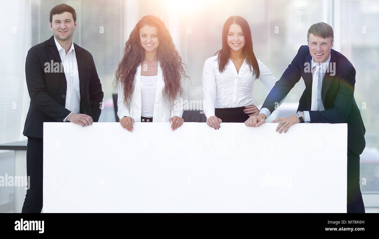 group of business people with a blank banner Stock Photo - Alamy