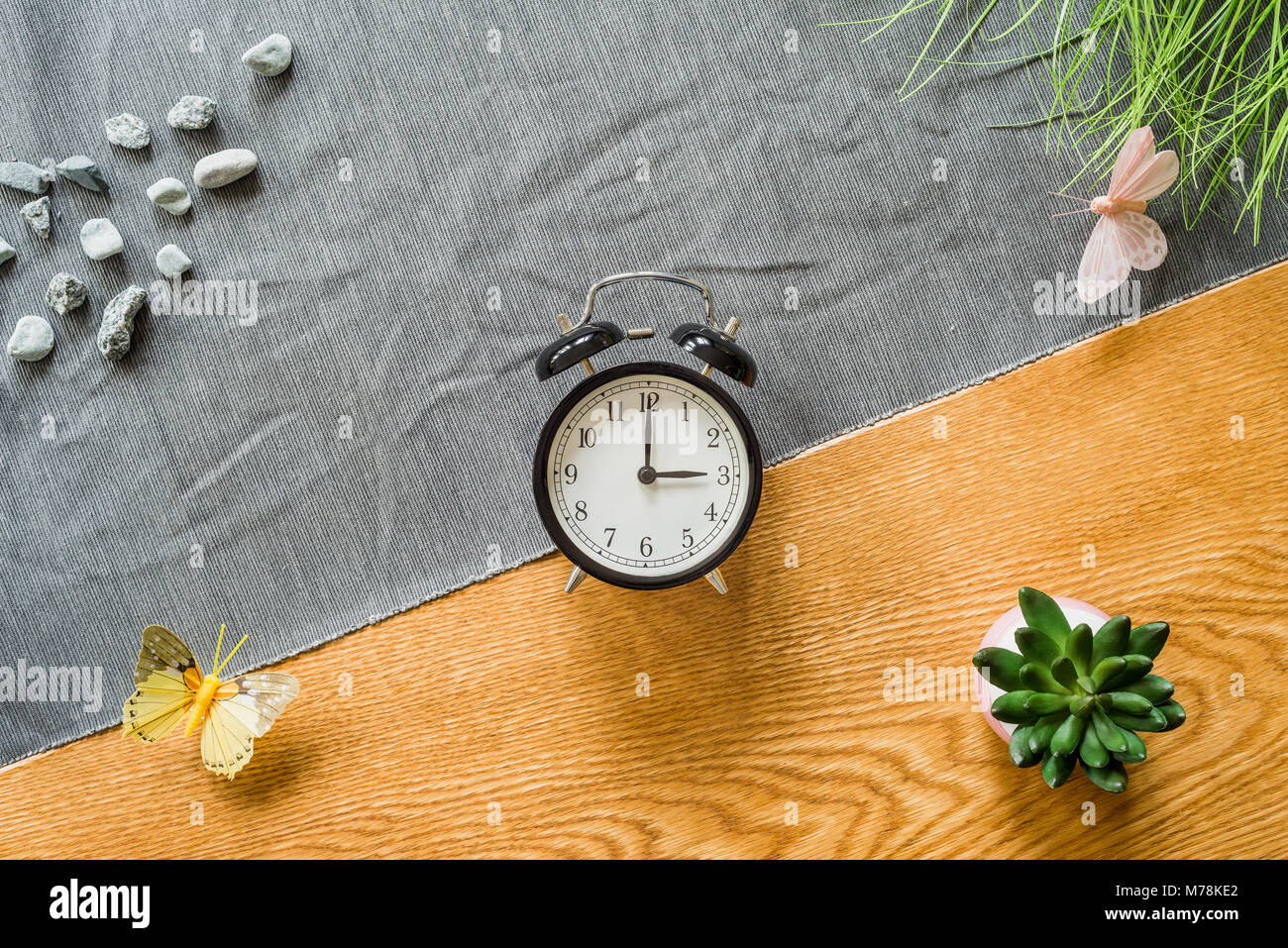 Change to daylight saving time photo of alarm clock from above as